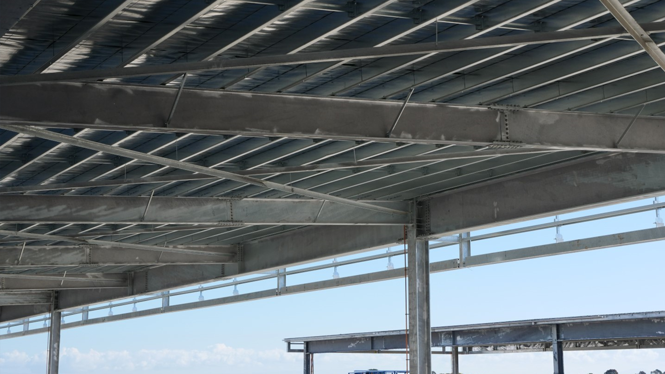 Structural steel hangar construction - Steel deck installation