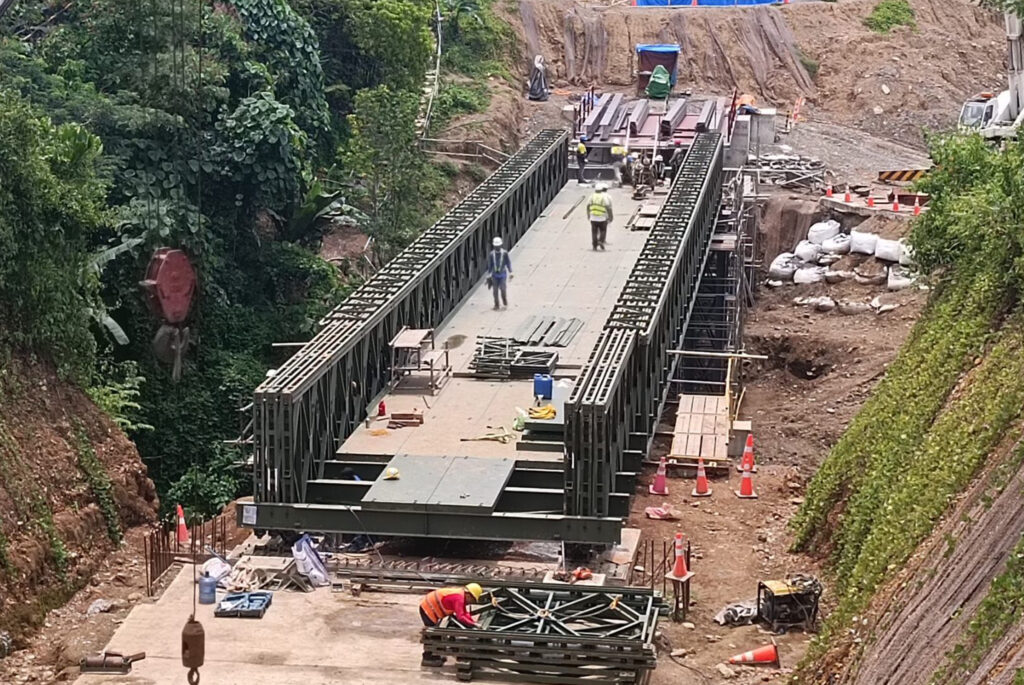 Pre-fabricated bailey steel bridge under construction